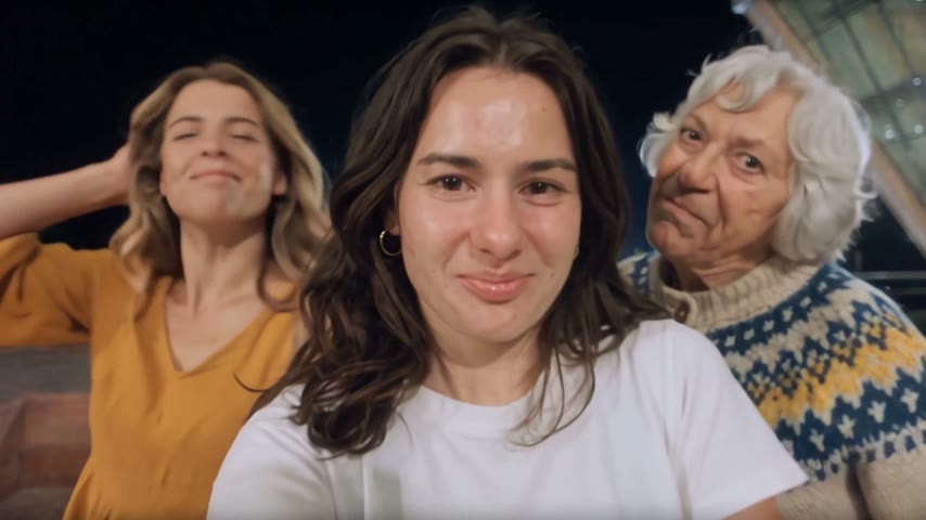 A young woman in a white T-shirt sings in the center, a woman in a yellow dress takes the left solo and a grandmother in a knitted cardigan takes the right one. Made from three photos.